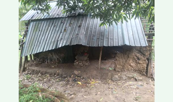 Cover Building a house for a poor family with a broken house