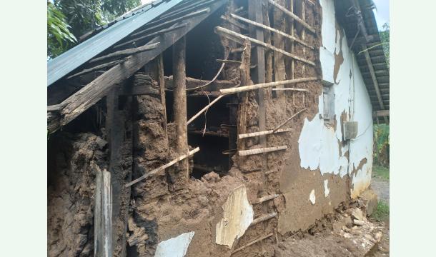 Cover Building a house for a poor family with a broken house