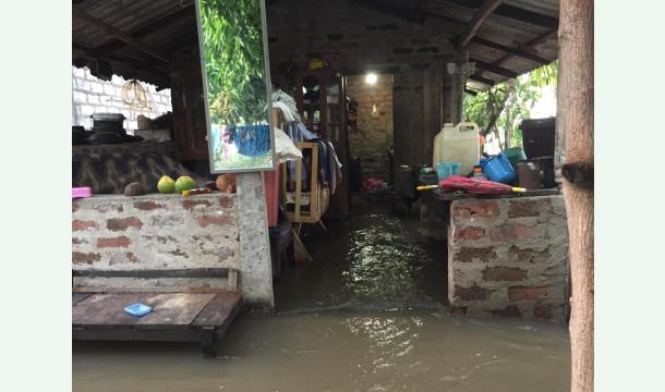 Cover Help rebuild flood damaged homes